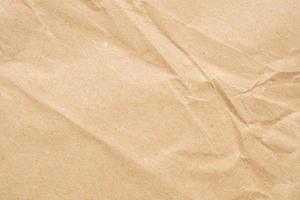 Abstract crumpled and creased recycle brown paper texture background photo