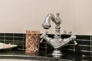 Luxury vintage faucet in the bathroom photo