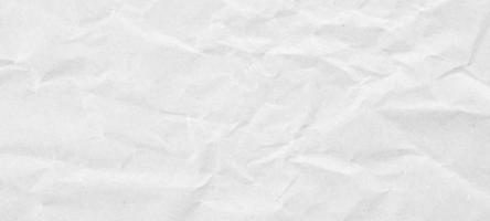 Abstract white crumpled and creased recycle paper texture background photo