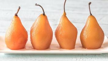 Poached pears on the plate photo