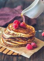 Stack of pancakes with raspberries photo