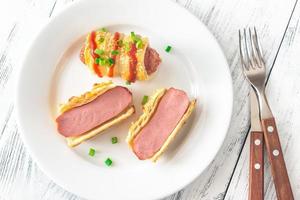 Sausage rolls on the white plate photo