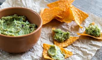 Guacamole with tortilla chips photo