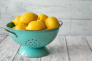 Fresh lemons in the colander photo