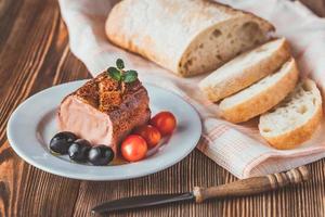 Chicken liver pate on the white plate photo