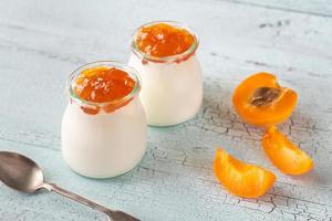 Two jars of Greek yogurt with apricot photo