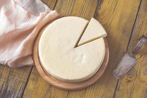 Traditional cheesecake on the wooden table photo