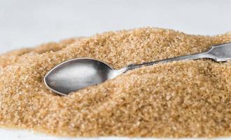 Spoon in brown sugar photo