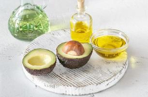 Fresh avocado with avocado oil photo