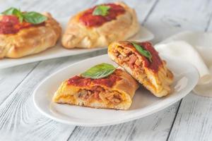 Homemade calzone on the plate photo