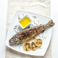 Grilled trout with lemon and rosemary photo