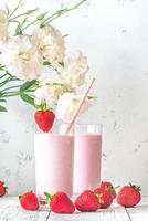 Two glasses of strawberry shake photo