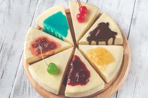 Cheesecake with different toppings photo