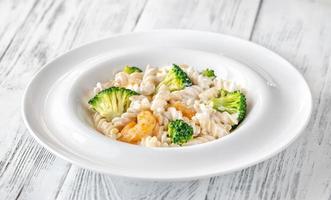 Fusilli with broccoli and shrimps photo