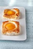 Puff pastry with canned peaches photo