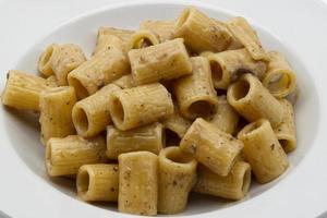 Italian Macaroni pasta with porcini mushroom sauce. photo