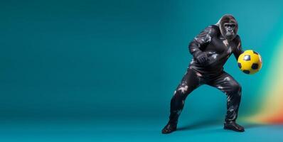 Studio shot of gorilla in dress holding ball, stylized as sports model, against blue copy space background. photo