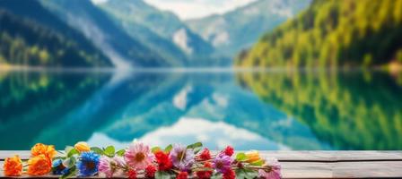 empty wooden table decorated with colorful flowers. Blurred lake and mountain view background. copy space. For product displays. templates, media, printing, etc., generate ai photo