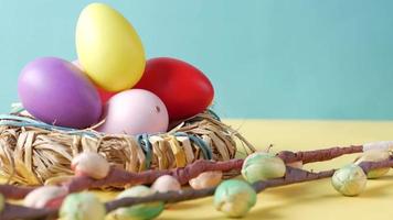 close up of easter concept with multi color egg on blue background video