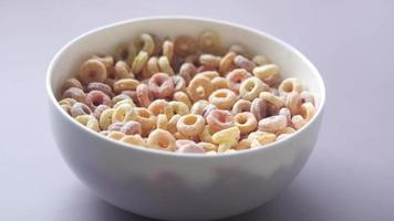 Close up of colorful cereal flakes in a bowl video