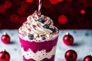 A glass of milkshake with whipped cream and blackberries.Strawberry milkshake, Raspberry milkshake. photo