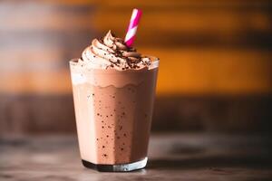 A glass of milkshake with whipped cream and blackberries.Strawberry milkshake, Raspberry milkshake. photo