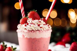 A glass of milkshake with whipped cream and blackberries.Strawberry milkshake, Raspberry milkshake. photo