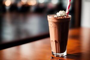 A glass of milkshake with whipped cream and blackberries.Strawberry milkshake, Raspberry milkshake. photo