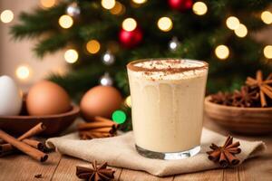 Eggnog with whipped cream and cinnamon on a Christmas background. photo