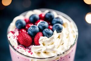 A glass of milkshake with whipped cream and blackberries.Strawberry milkshake, Raspberry milkshake. photo