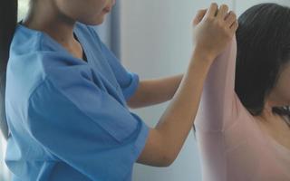 Patient doing some special exercises under supervision in a room photo