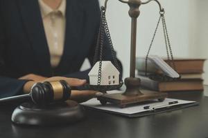 Judge gavel with Justice lawyers having team meeting at law firm background. Concepts of Law and Legal services. photo