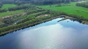 Drone view of man made lakes and ponds in a northern German landscape. video