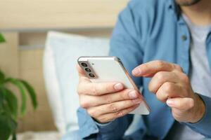 Man hands with smartphone. Lifestyle. Easy pay online banking using smartphone or digital device. Communication via app for sale in shop. Social media. photo