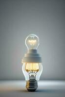 Glowing light bulb with filament on grey background. 3D rendering photo