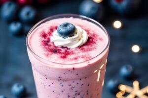 A glass of milkshake with whipped cream and blackberries.Strawberry milkshake, Raspberry milkshake. photo