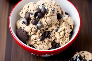 delicious Homemade ice cream with chocolate chips in a bowl on a wooden table. sweet food. photo