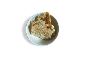 savory snack, tempeh chips in a white bowl on a white background - Indonesian street food photo