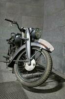 vintage road motorcycle front view wheel in the foreground photo