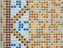 colorful mosaic stones on a house wall photo