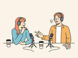 Smiling people in headsets talking in microphones at live radio broadcast. Happy host interview guest recording podcast in studio. Vector illustration.