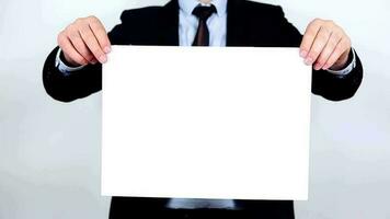 Businessman holding blank white lettering sign video