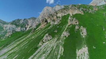 Aerial view shot of flowing Waterfall down mossy mountain in Azerbaijan video