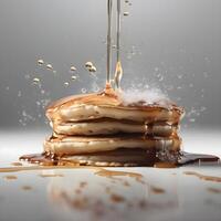 Pancakes with maple syrup and honey on a black background., Image photo