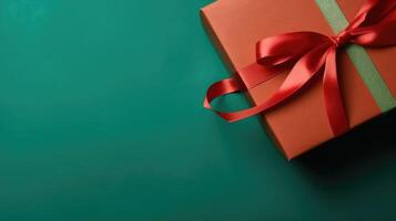 Gift box with a red ribbon on a green background. Festive decoration of a gift, surprise.. Created with photo