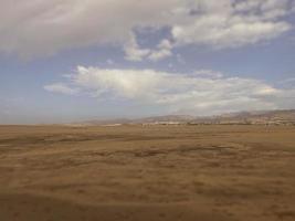 summer desert landscape on a warm sunny day from Maspalomas dunes on the Spanish island of Gran Canaria photo