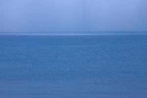 calm blue sea landscape with cloudless sky and water photo