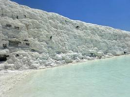 original Pamukkale place in Turkey in Asia landscape with limestone pools with blue warm water photo