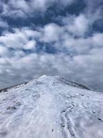 A view of the Caradoc Hils in winter with Snow on Top photo