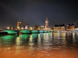 A view of the Houses of Parliament in London at night photo